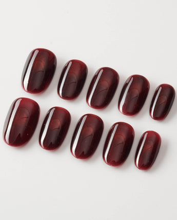 Deep Red Cat eye Nails press-on nails in short oval shape — red cat eye christmas holiday