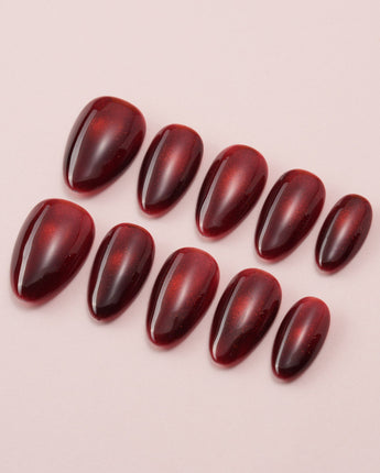 Deep Red Cat eye Nails press-on nails in extra short almond shape — red cat eye christmas holiday