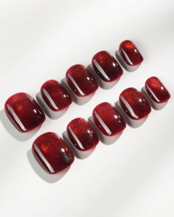 Deep Red Cat eye Nails press-on nails in extra short squoval shape — red cat eye christmas holiday