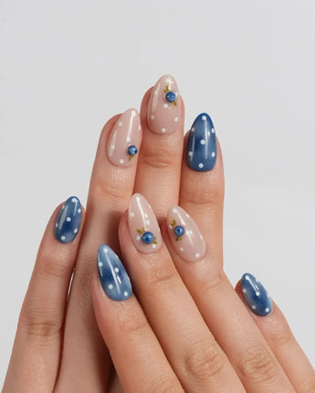 Denim Berry hand-painted fruit nail art with vintage indigo and nude base colors