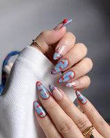 Denim Cherry Y2K nails with nude base, denim blue tips, and hand-painted cherry accents
