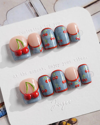 Denim Cherry medium almond press-ons with Y2K denim styling and juicy cherry motifs