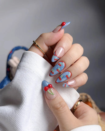 Denim Cherry playful summer nails with glossy red cherries and denim blue French tips