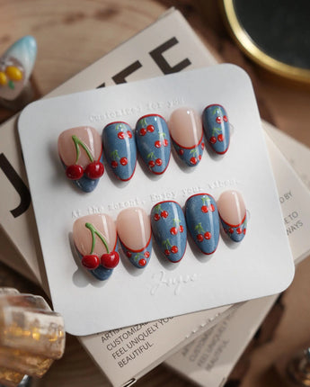 Denim Cherry extra short almond nails with denim fabric texture and red cherry French tips