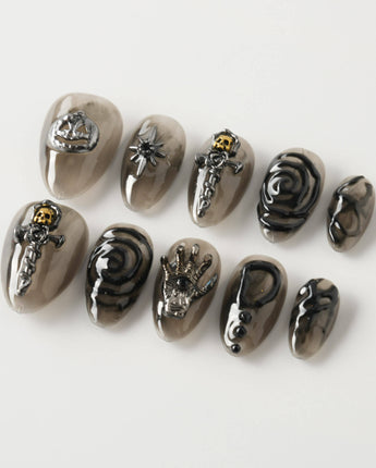 Devil Charm press-on nails in extra short almond shape — Sheer Black Gothic, 3D Skull & Dark Aesthetic.