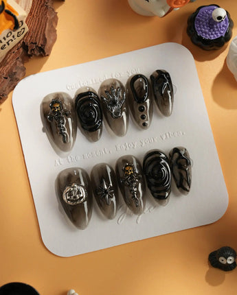 Devil Charm press-on nails in medium almond shape — Sheer Black Gothic, 3D Skull & Dark Aesthetic.