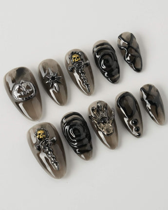 Devil Charm press-on nails in short almond shape — Sheer Black Gothic, 3D Skull & Dark Aesthetic.