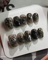 Devil Charm press-on nails in short oval shape — Sheer Black Gothic, 3D Skull & Dark Aesthetic.