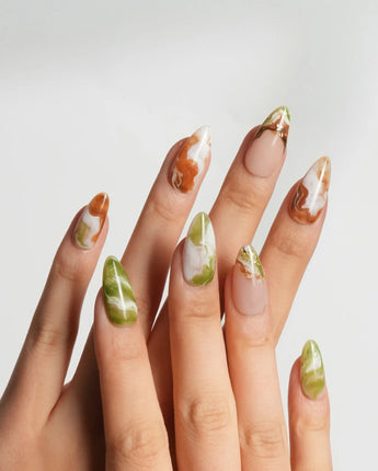 Double Latte glossy coffee and matcha nails with understated marbled patterns
