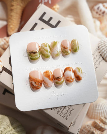 Double Latte coffee and matcha marble press-on nails in extra short oval shape
