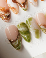 Double Latte medium almond nails with coffee brown and matcha green marble swirls