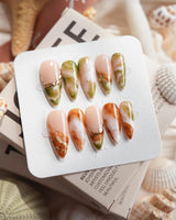 Double Latte coffee and matcha marble press-on nails in medium stiletto shape