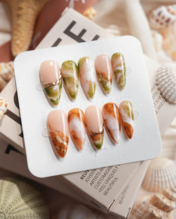 Double Latte coffee and matcha marble press-on nails in medium stiletto shape