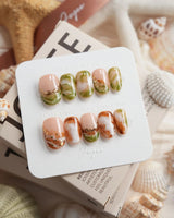 Double Latte coffee and matcha marble press-on nails in short oval shape