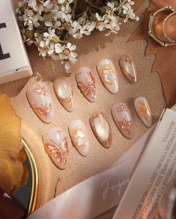 Dreamland Glow handmade press-on nails featuring gold 3D sculpted wedding bridal butterfly autumn fall