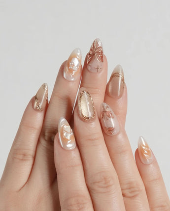 Dreamland Glow press-on nails with gold 3D sculpted butterflies and bridal fall shimmer