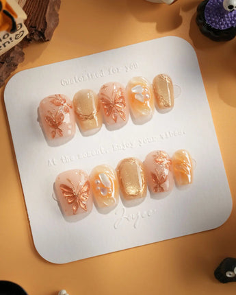 Dreamland Glow press-on nails with sculpted gold butterflies and dreamy fall bridal nail art