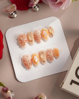 Dreamland Glow press-on nails with gold sculpted butterflies and luminous fall nail art