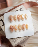 Dreamland Glow short stiletto press-on nails with gold butterfly accents and dreamy fall shimmer