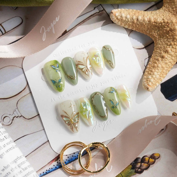 Green butterfly nails with gold border