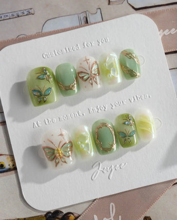 Dreamland handmade green nails with 3D gold butterfly and vine details