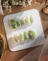 Dreamland forest-shadow green nails with sculpted butterfly and vine accents