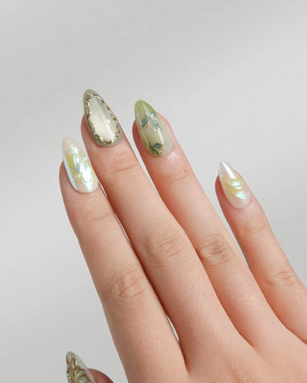 Dreamland magical sage green nails with gold vines and cat-eye depth