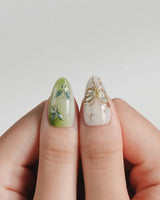 Dreamland green cat-eye nails with dimensional butterfly and vine design