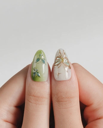 Dreamland green cat-eye nails with dimensional butterfly and vine design
