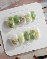 Dreamland green butterfly press-on nails with luminous cat-eye gel finish