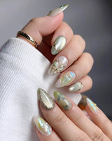 Dreamland close-up of layered green butterfly wings and vine nail art