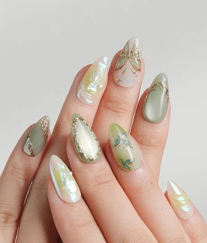Dreamland green cat-eye nail set with chrome lines and 3D gold butterfly