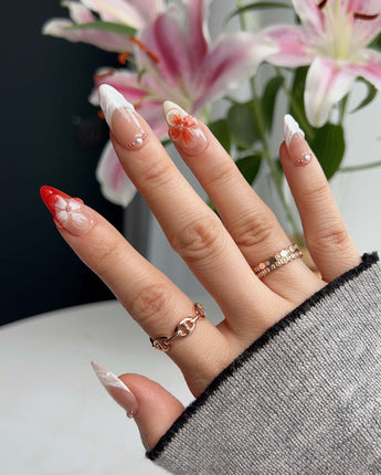 Duchess Marigold short almond press-on nails with sculpted orange floral tips