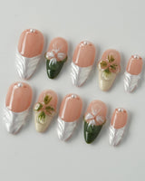 Duchess Olive in medium almond shape with olive French tips and raised floral art