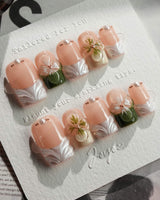 Duchess Olive in short square shape with olive green French tips and 3D flower accents