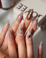 Egyptian Gold custom size press-on nails in medium stiletto with gold 3D charms