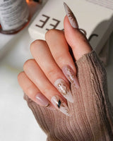 Egyptian Gold luxury press-on nails with raised sun face, scarab and ankh designs