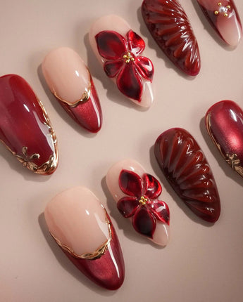 Lily Rouge handmade press-on nails featuring nude base red cat eye french gold outline 3D flower cat eye effect