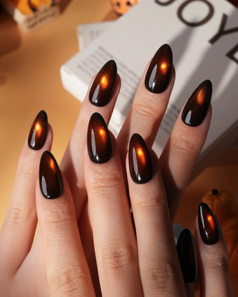 Ember spotlight cat eye press on nails, dark coffee brown with a glowing amber magnetic spot - image 1