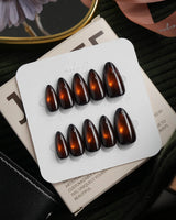Ember spotlight cat eye press on nails, dark coffee brown with a glowing amber magnetic spot - image 2