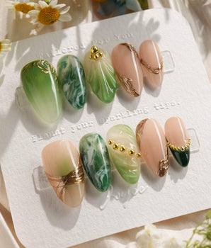 Emerald - Jade Sutra handmade press-on nails featuring Elegant Grape Green, Marble Smudge & Liquid Metal.