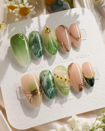 Emerald - Jade Sutra handmade press-on nails featuring Elegant Grape Green, Marble Smudge & Liquid Metal.