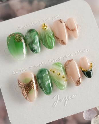 Emerald - Jade Sutra press-on nails in extra short almond shape — Elegant Grape Green, Marble Smudge & Liquid Metal.
