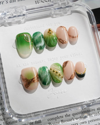 Emerald - Jade Sutra press-on nails in extra short oval shape — Elegant Grape Green, Marble Smudge & Liquid Metal.