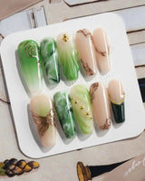 Emerald - Jade Sutra press-on nails in long coffin shape — Elegant Grape Green, Marble Smudge & Liquid Metal.