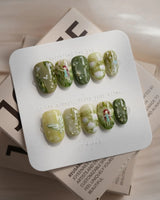 Emerald Wild press-on nails in short oval shape — Mori Monet's Garden, Hand-painted Forest Fairies & 3D Water Droplets.