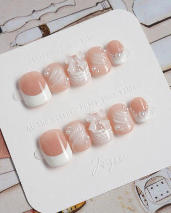 Engagement press-on nails in extra short squoval shape — Elegant Style, Pearl Outlines & 3D Ribbon Bows.