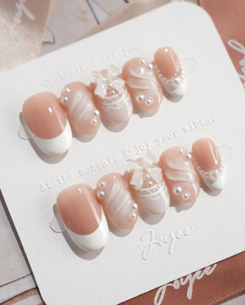 Engagement press-on nails in short oval shape — Elegant Style, Pearl Outlines & 3D Ribbon Bows.