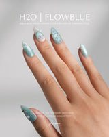 Exuma Blue short almond nails with Tiffany blue jelly gloss, 3D hearts, and ripple details