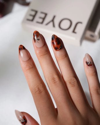 Pumpkin Patch fall tortoise press-on nails with amber swirls and gold line handmade by Joyee Nails